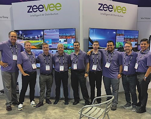 Hands-on PR support gets real at trade shows like InfoComm 23 in Orlando where Doug Wright (left), vice president, Feintuch Communications, joins long-term AV tech client ZeeVee in running its show activities.