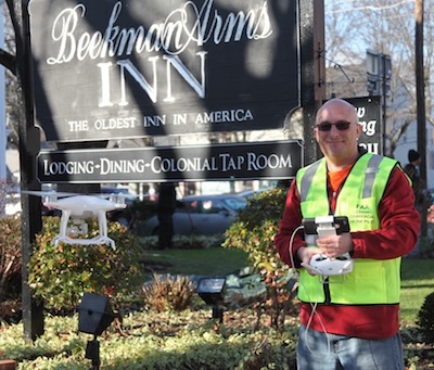 Roger Rosenbaum operates an aerial drone outside the Beekman Arms Hotel