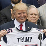 President Trump holding football jersey