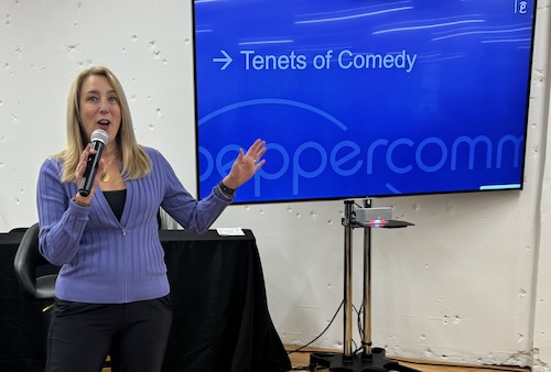 Jacqueline Kolek leading a presentation on humor for an agency-wide summit.